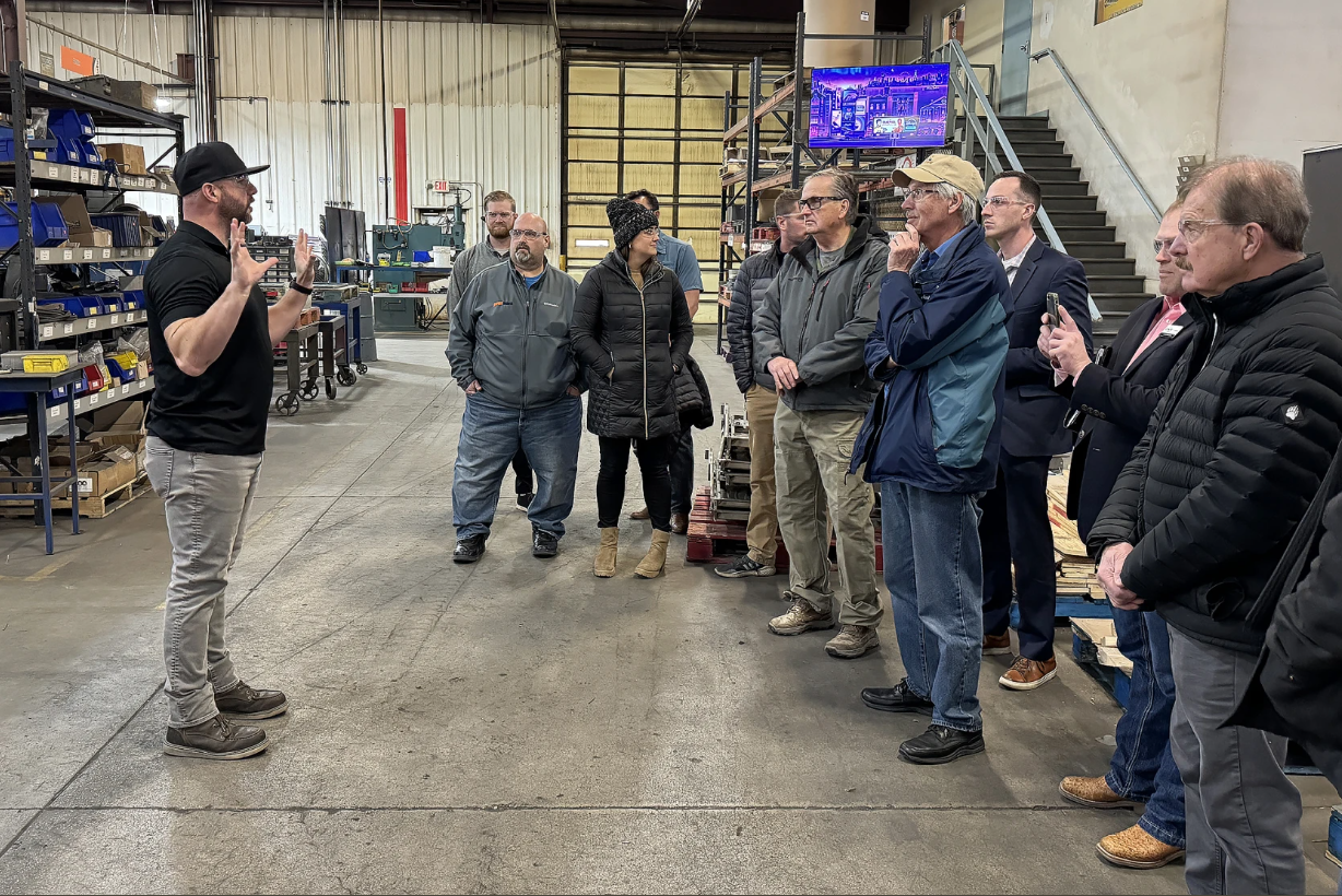 Click the Jamestown, state officials tour businesses that received automation grants slide photo to open