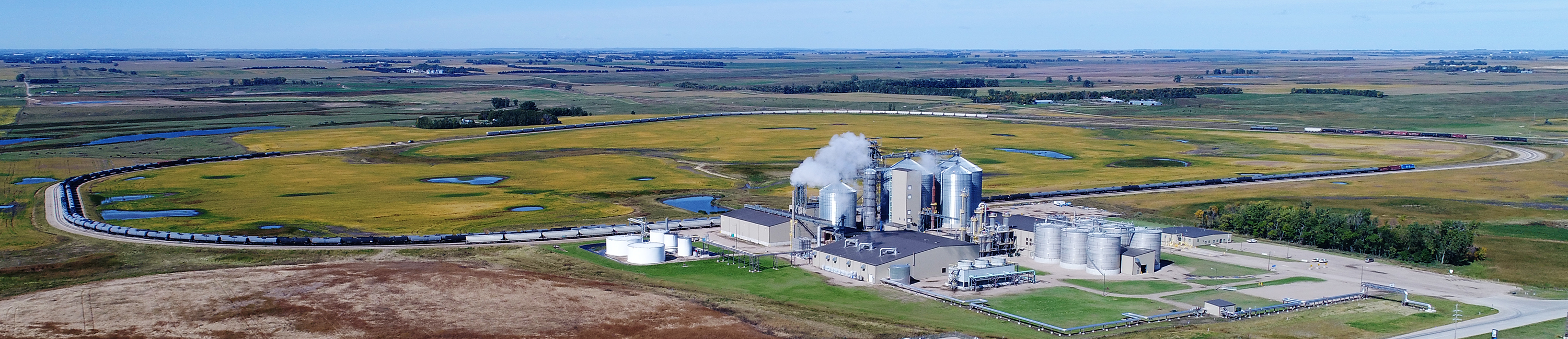 aerial view of grain elevators and trains